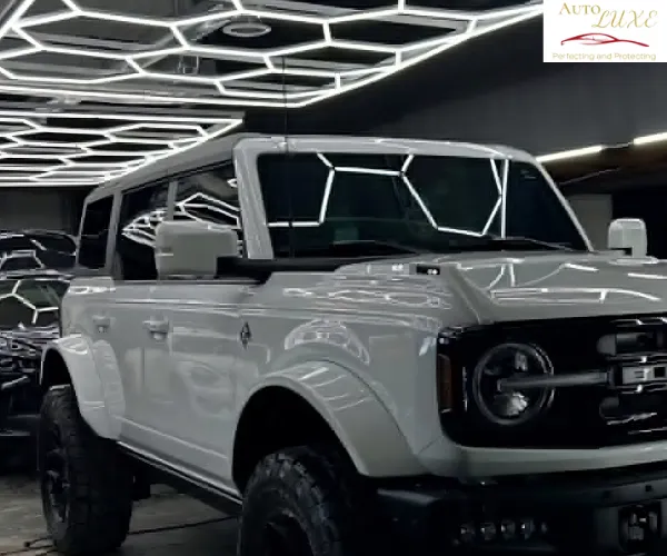 professionally installed automotive window tint on the side windows of a luxury vehicle